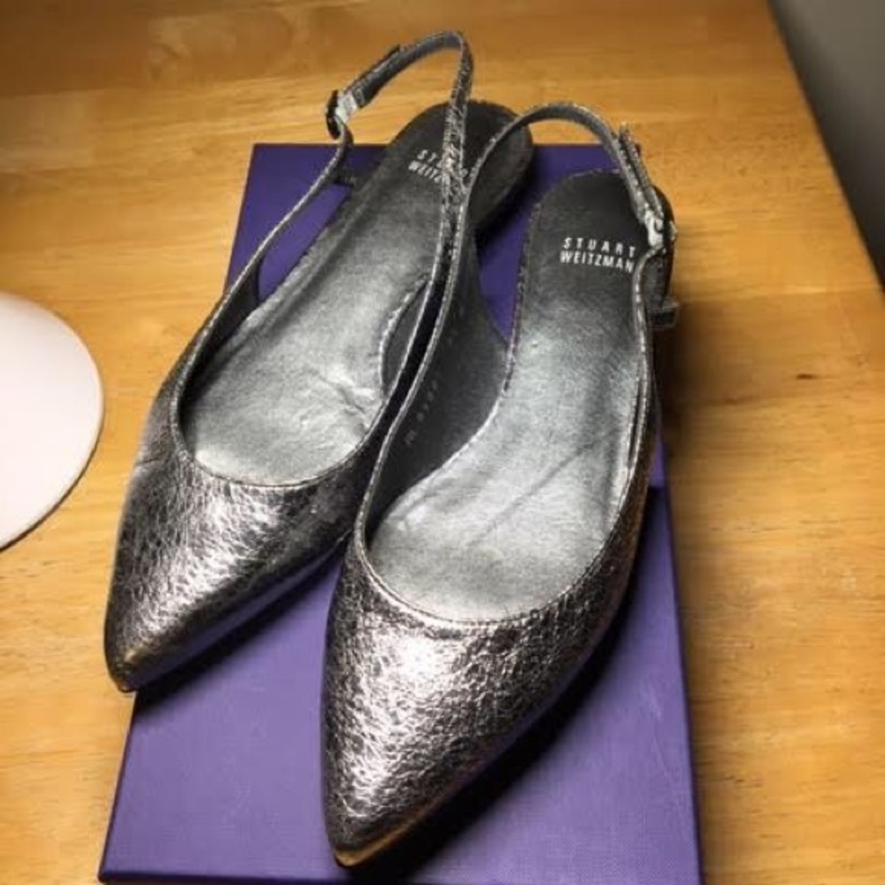 Stuart Weizmann silver slingback shoes.